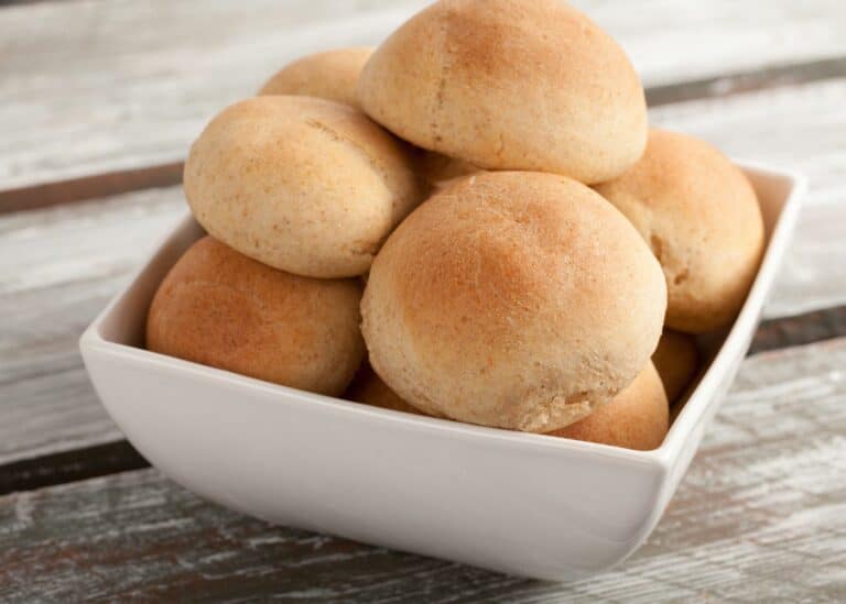 Gluten free and dairy free dinner rolls in a square dish.