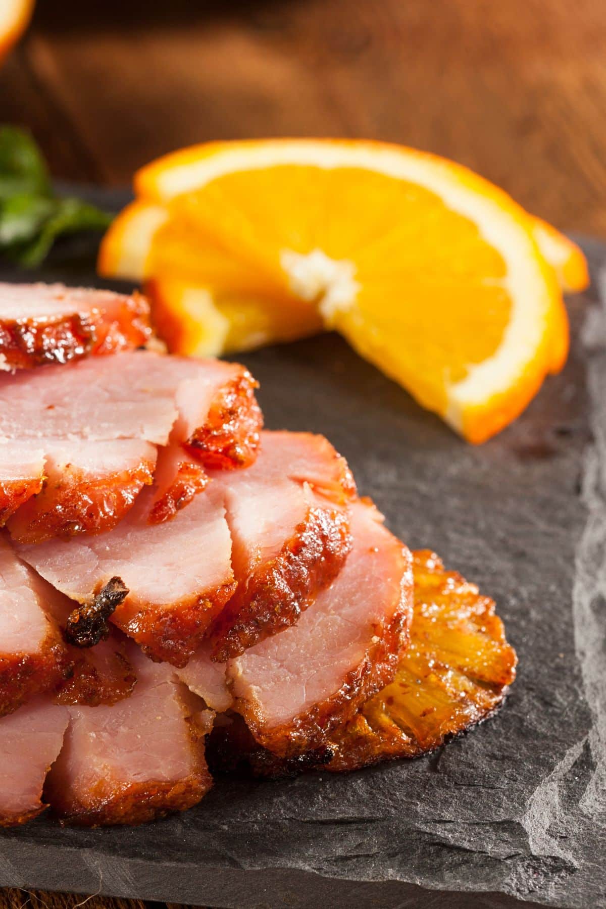 Ham slices on a stone board.