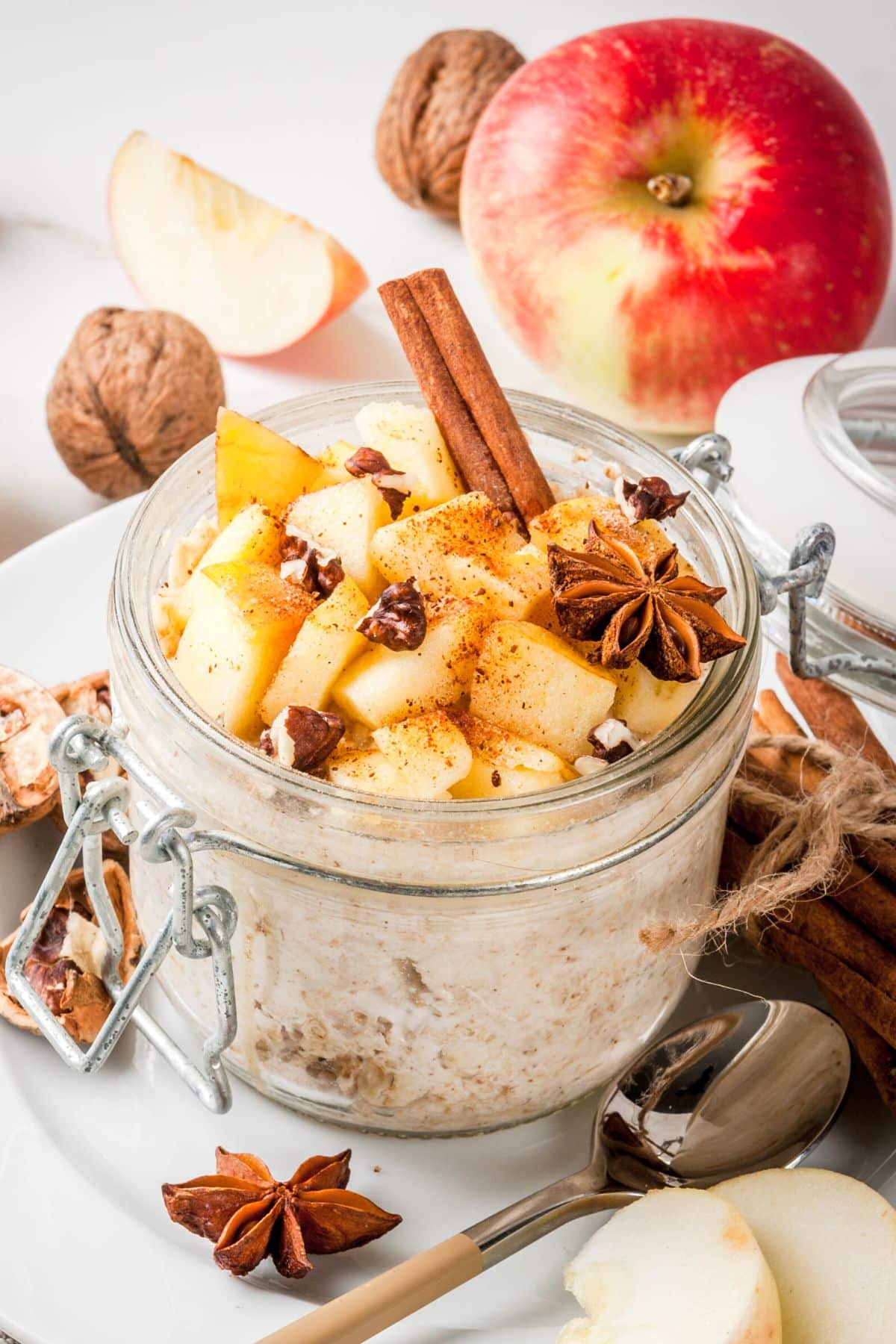 jar of instant pot steel cut oats served in jar with apple and cinnamon.