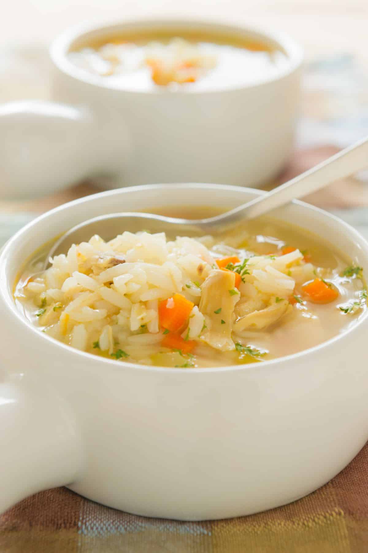 instant pot chicken rice soup in white bowl.
