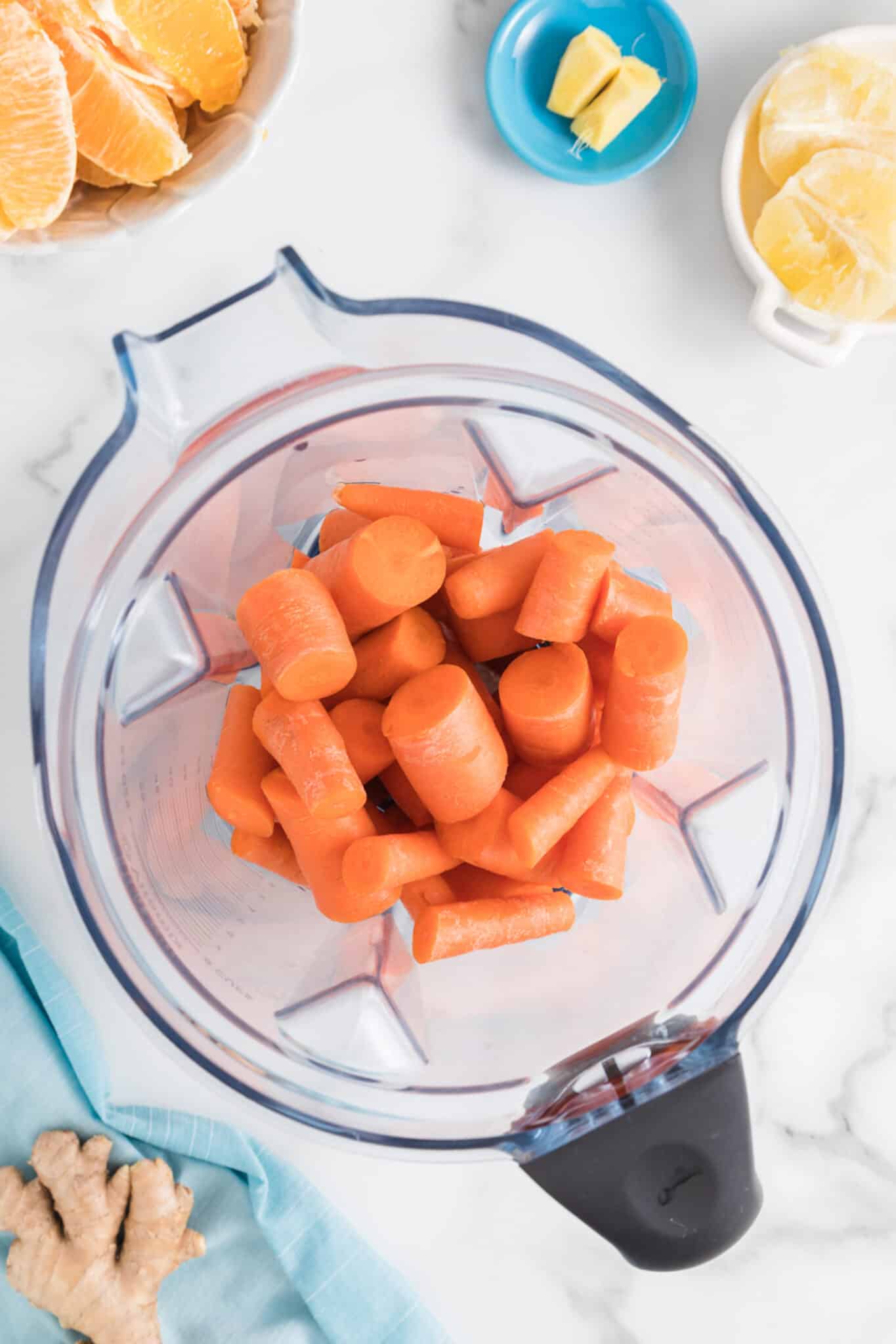 Chopped carrots in the jar of a high powered blender.