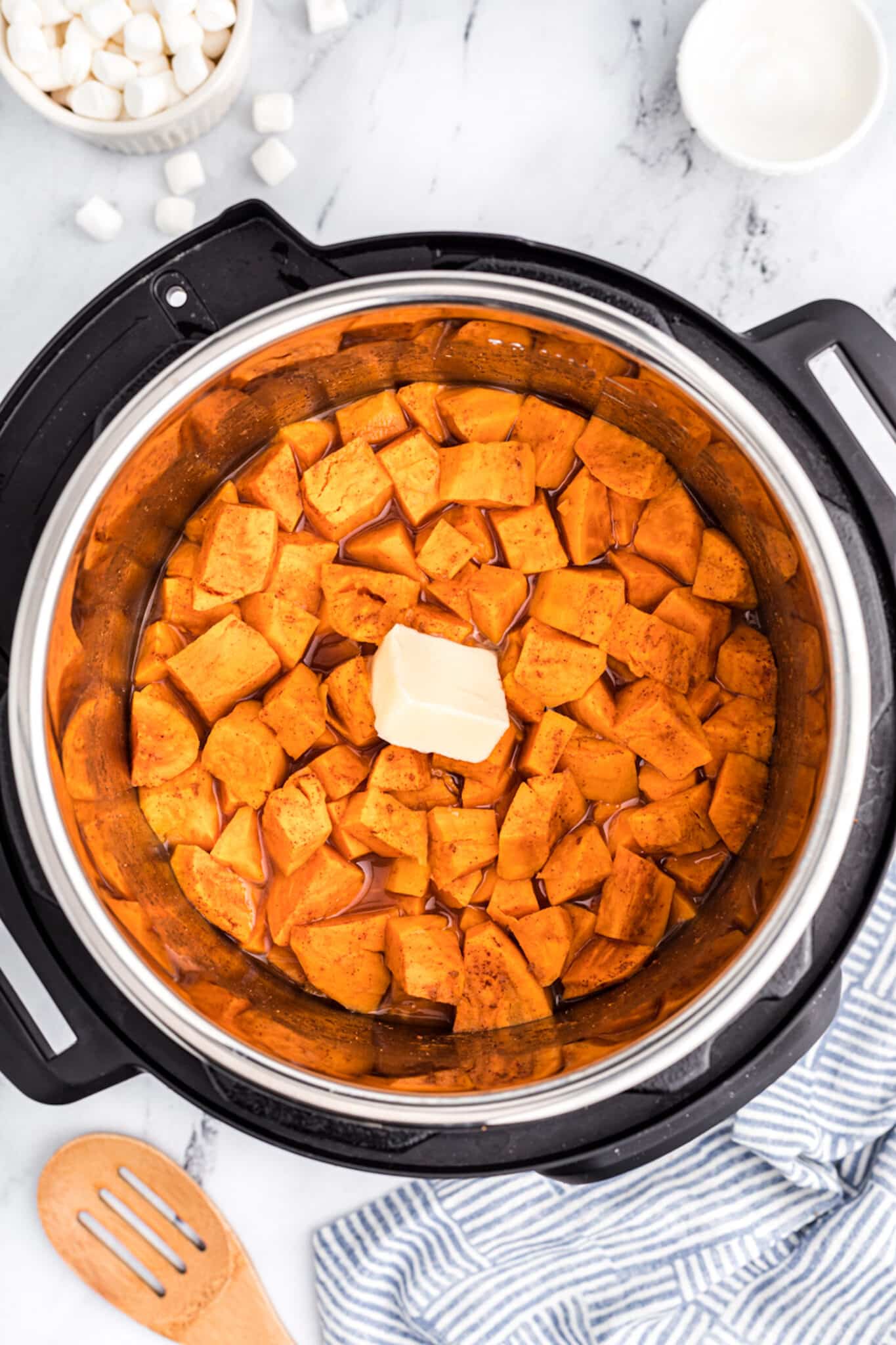 Diced yams in the insert of an Instant Pot.