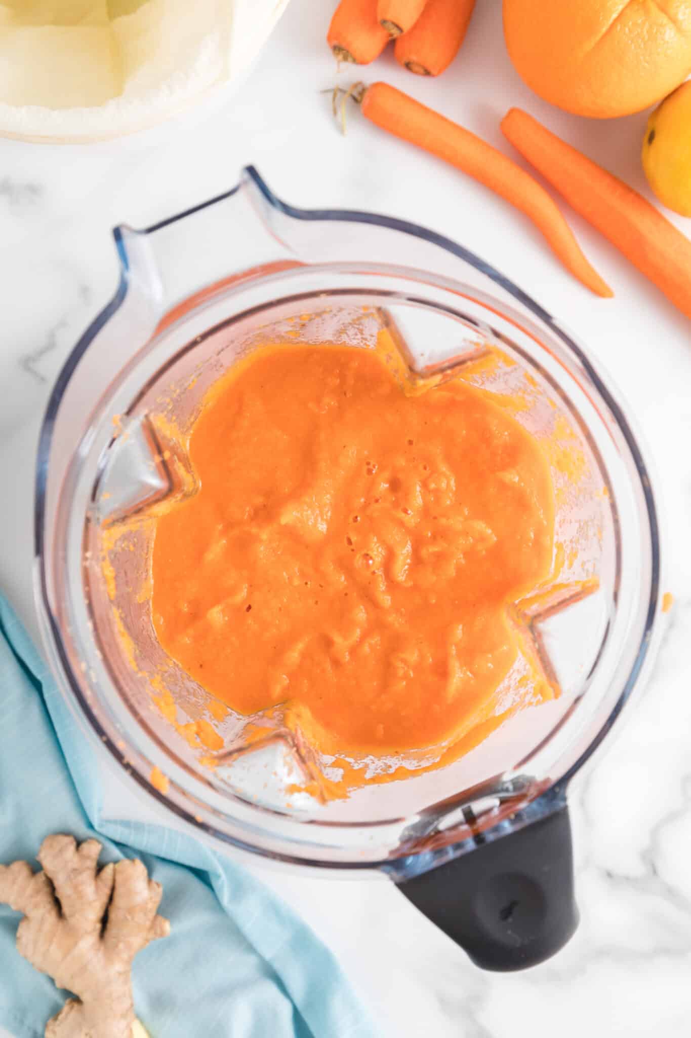 Carrot juice in the jar of a high powered Vitamix blender.