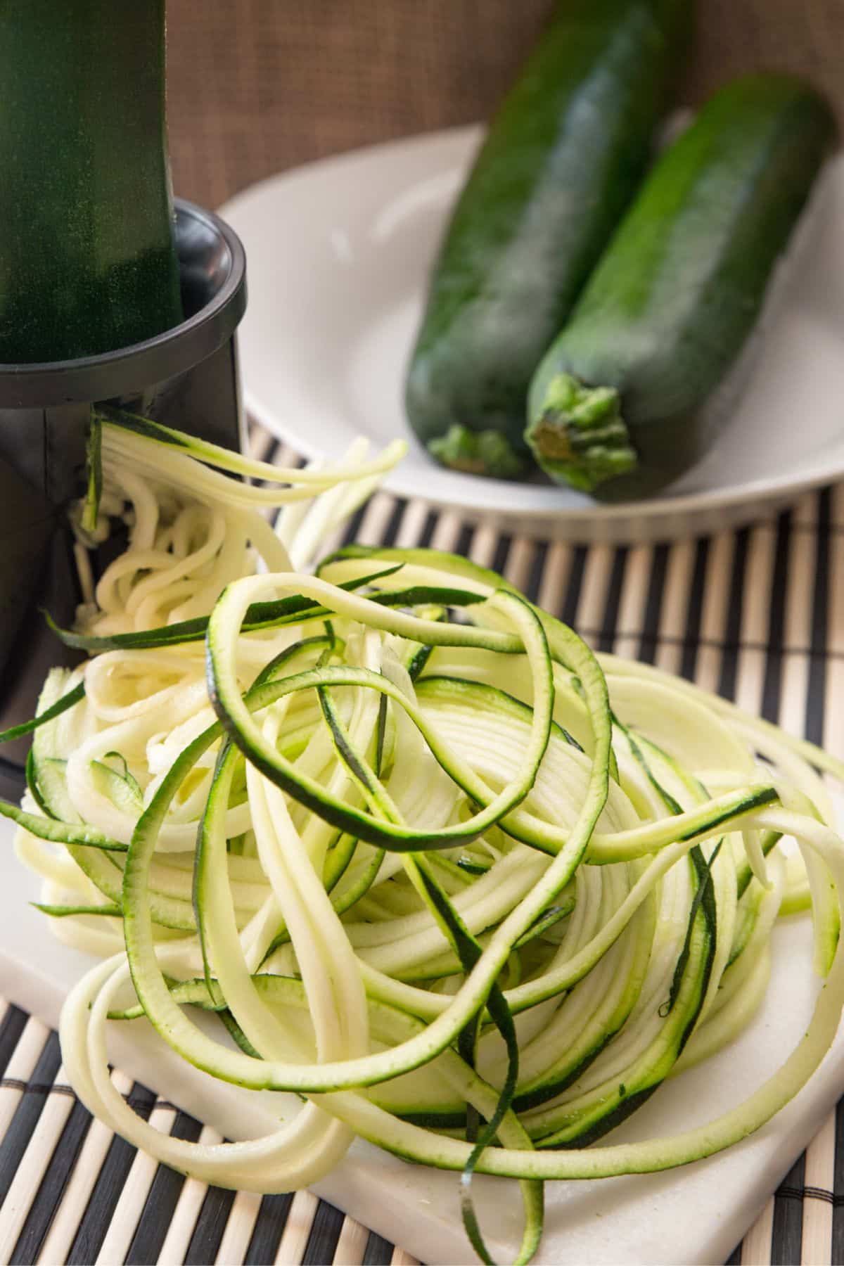 Spiralized zucchini in a pile on a counter.