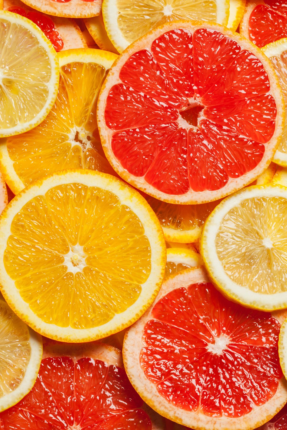 various slices of orange fruits stacked on top of each other.