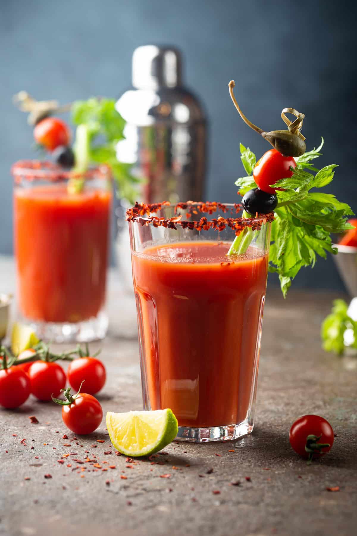 two glasses of a virgin Bloody Mary.