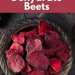 Dehydrated beet chips in a metal bowl.