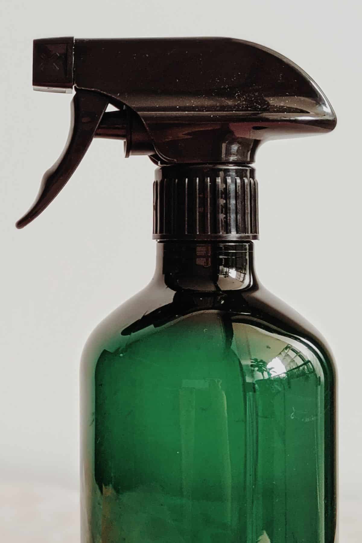 a green spray bottle.
