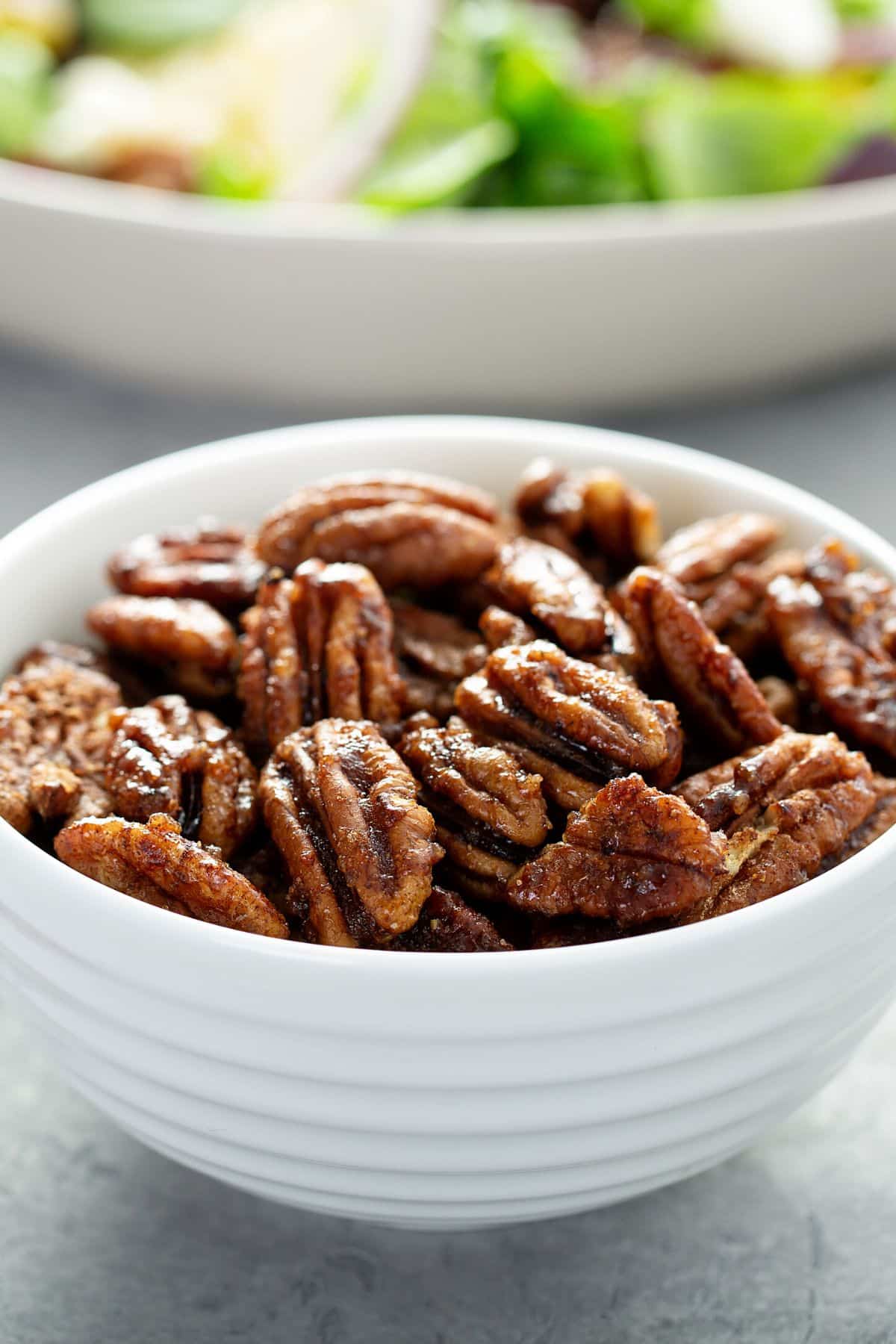 bowl of air fryer candied pecans ready to eat.