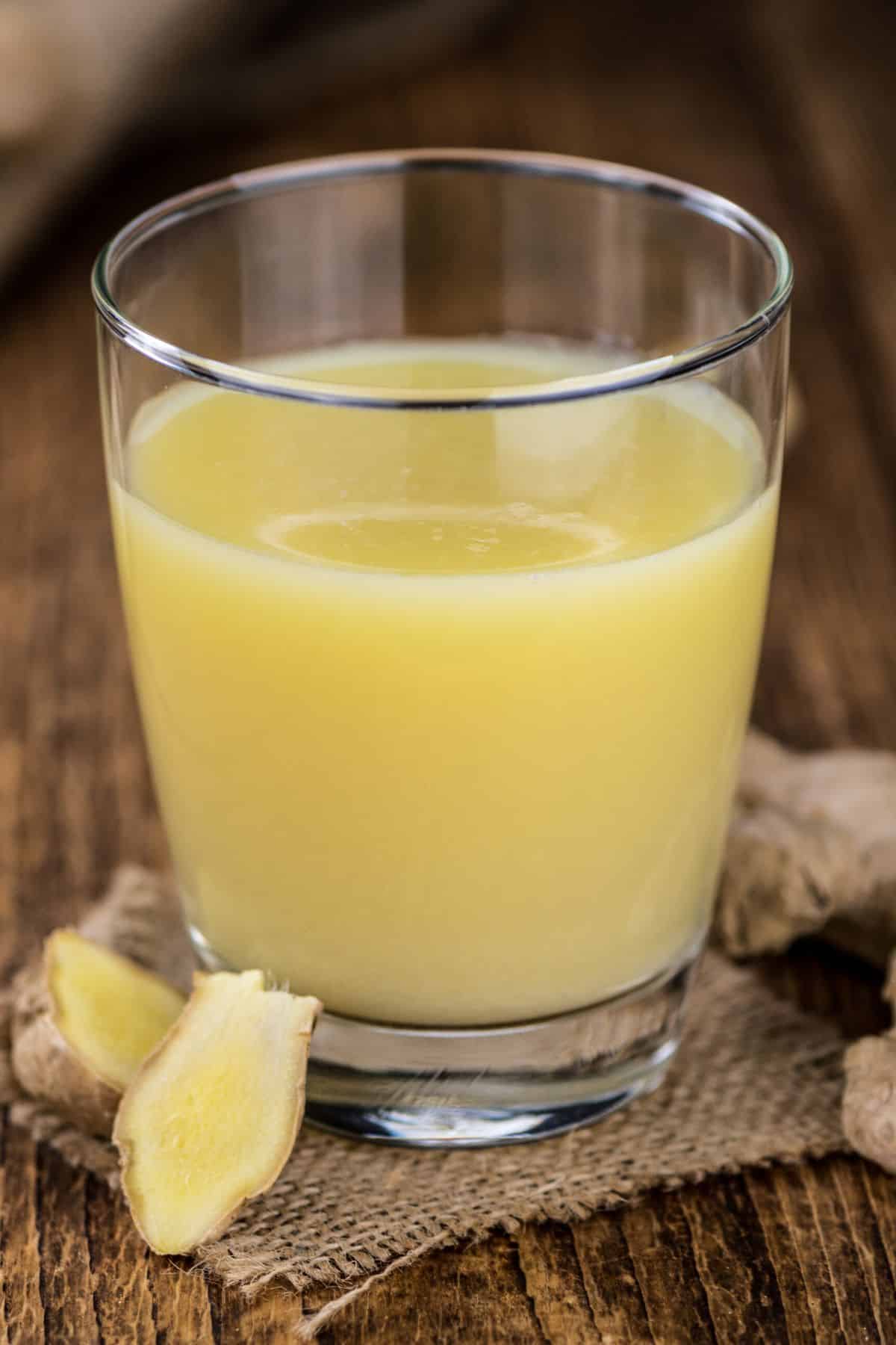 glass of ginger juice on table.