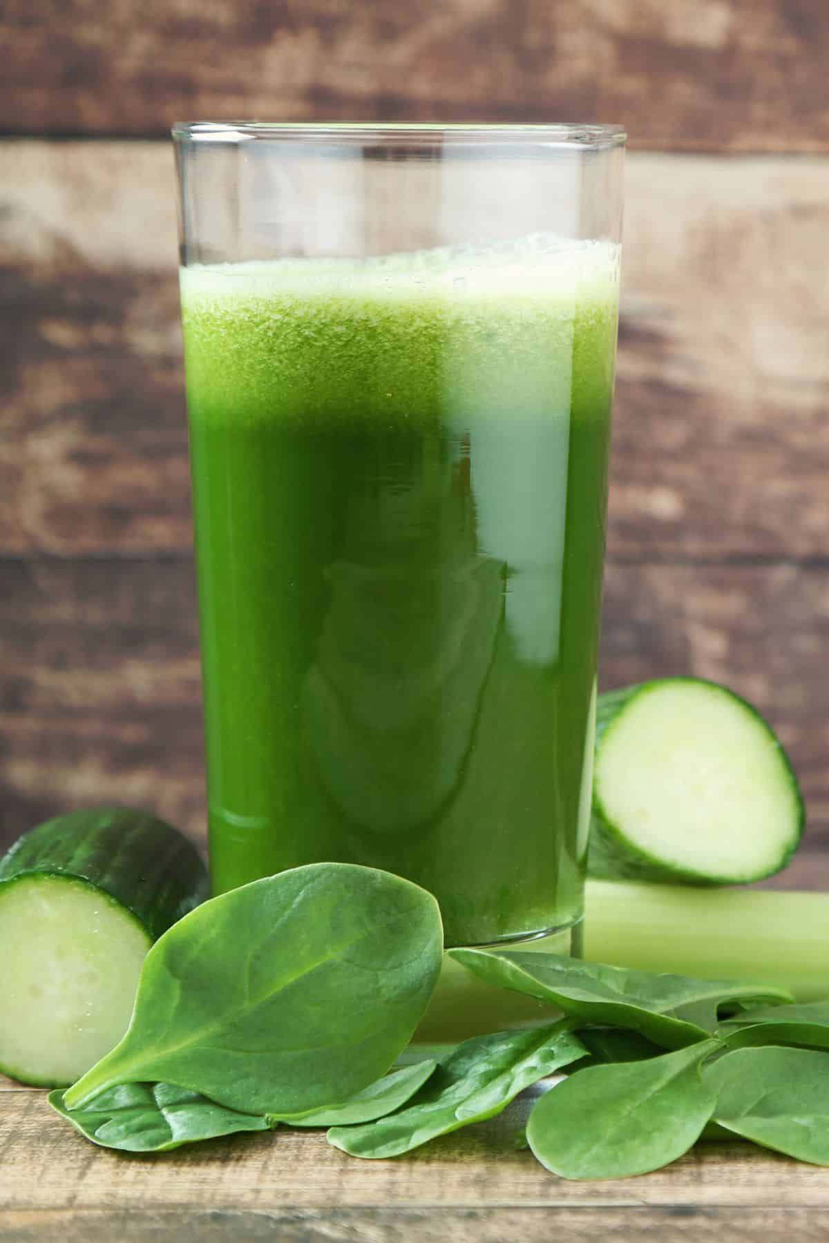 A tall glass of fresh spinach juice.