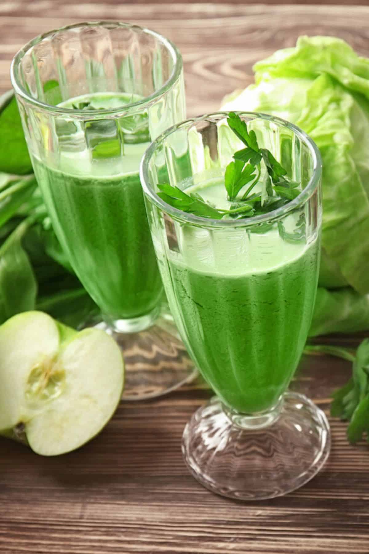 Two calls glasses of green cabbage juice.