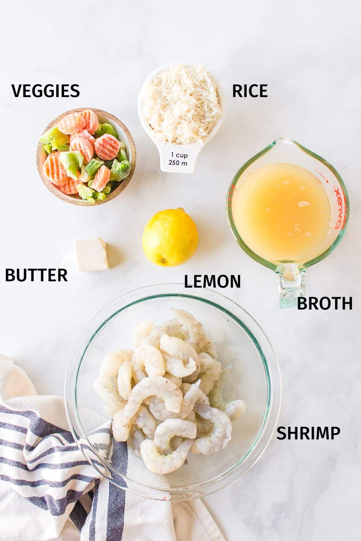 Ingredients to make shrimp and rice with veggies in the Instant Pot in small bowls.