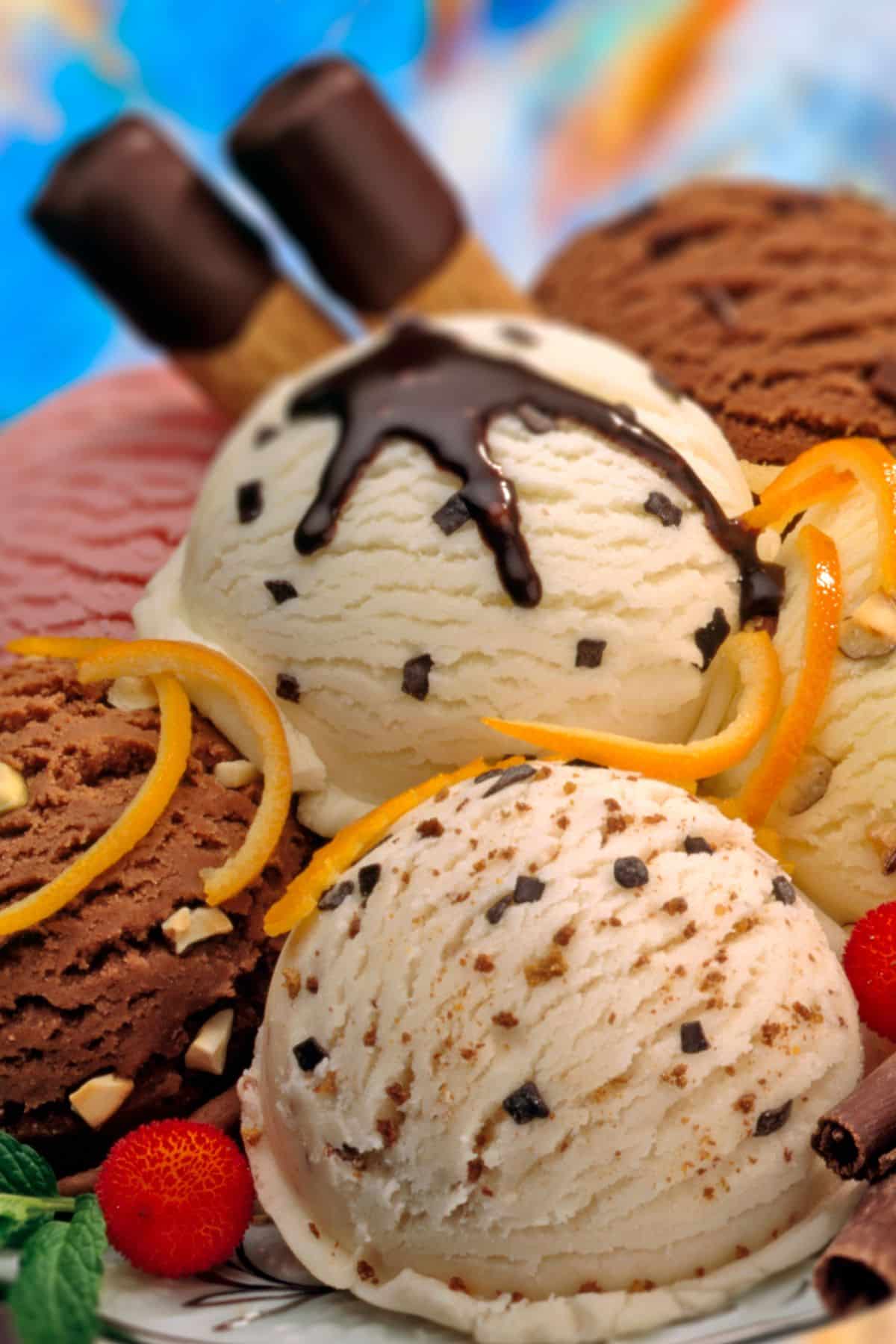 a variety of ice cream with toppings and chocolate.