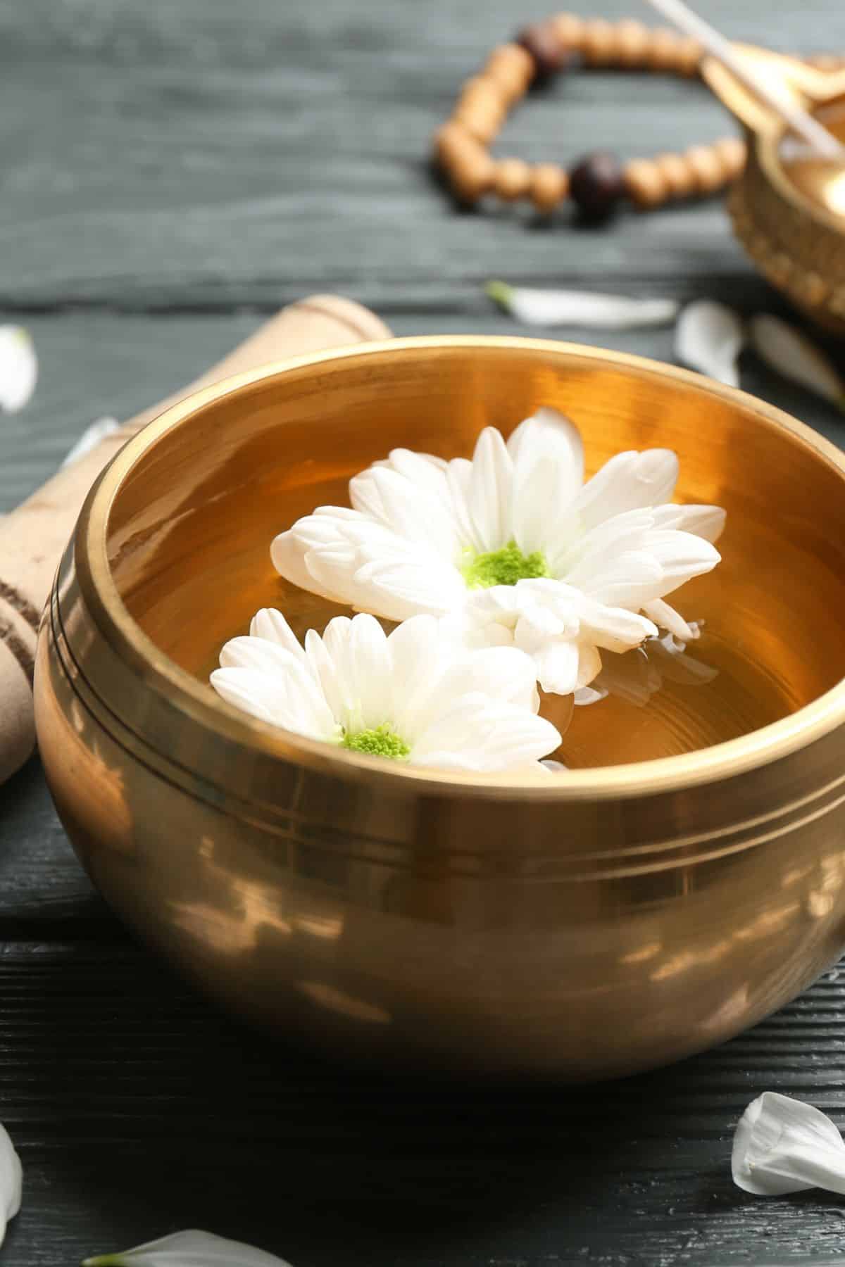 bowl with flowers on table.