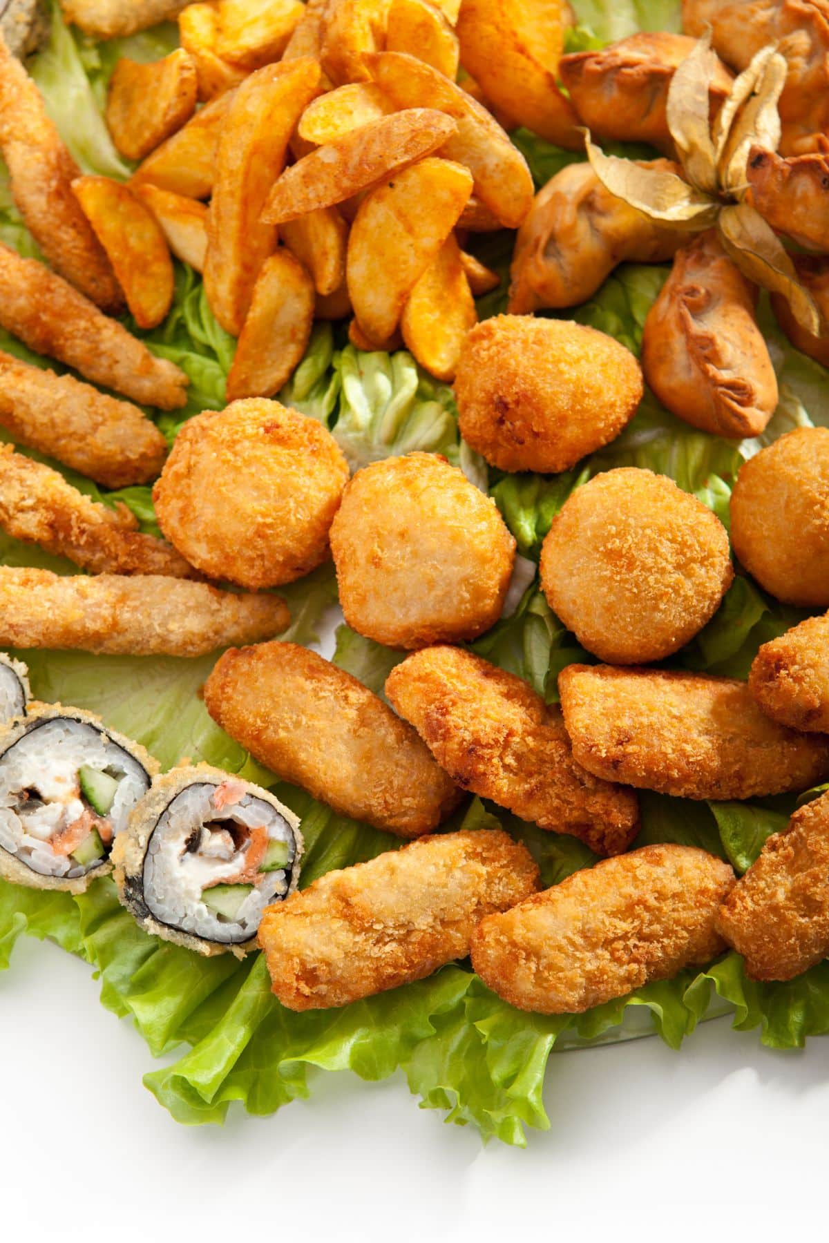 a variety of fried foods on a plate.
