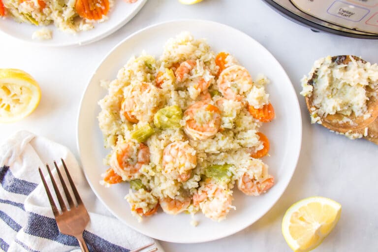Instant Pot Rice and Shrimp on a white dinner plate.