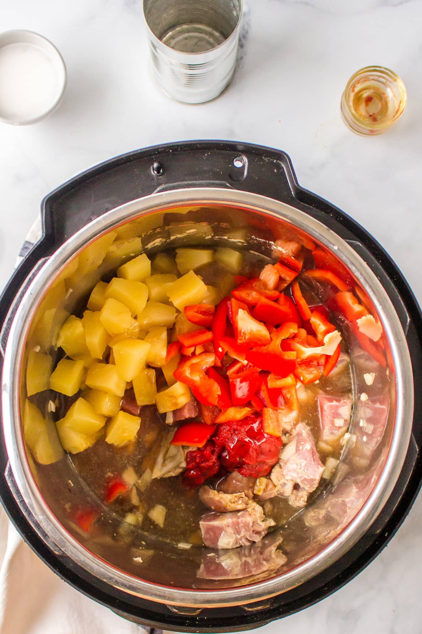 Pineapple and diced peppers with pork in an Instant Pot.