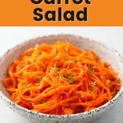 Shredded carrot salad topped with thyme.