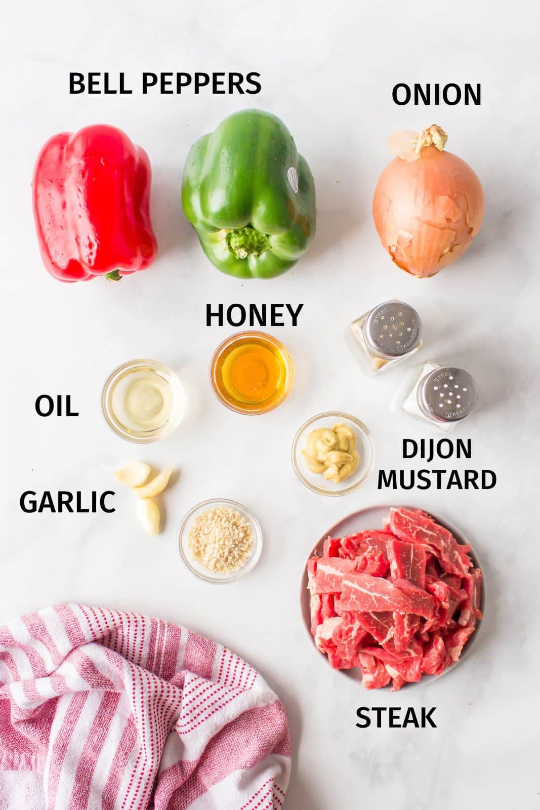 ingredients for pepper steak on a counter.