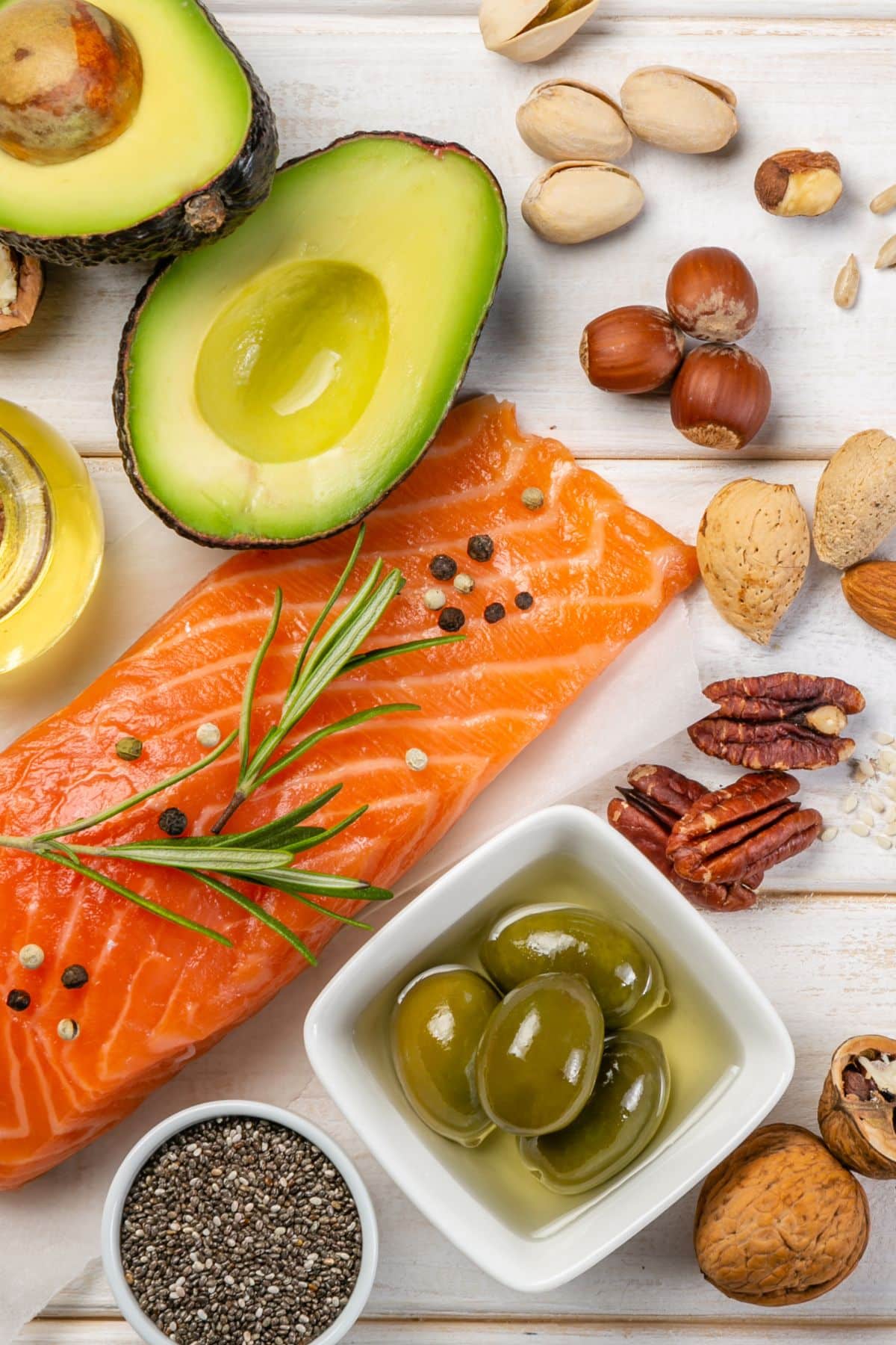 a variety of foods high in omega-3s on a table.