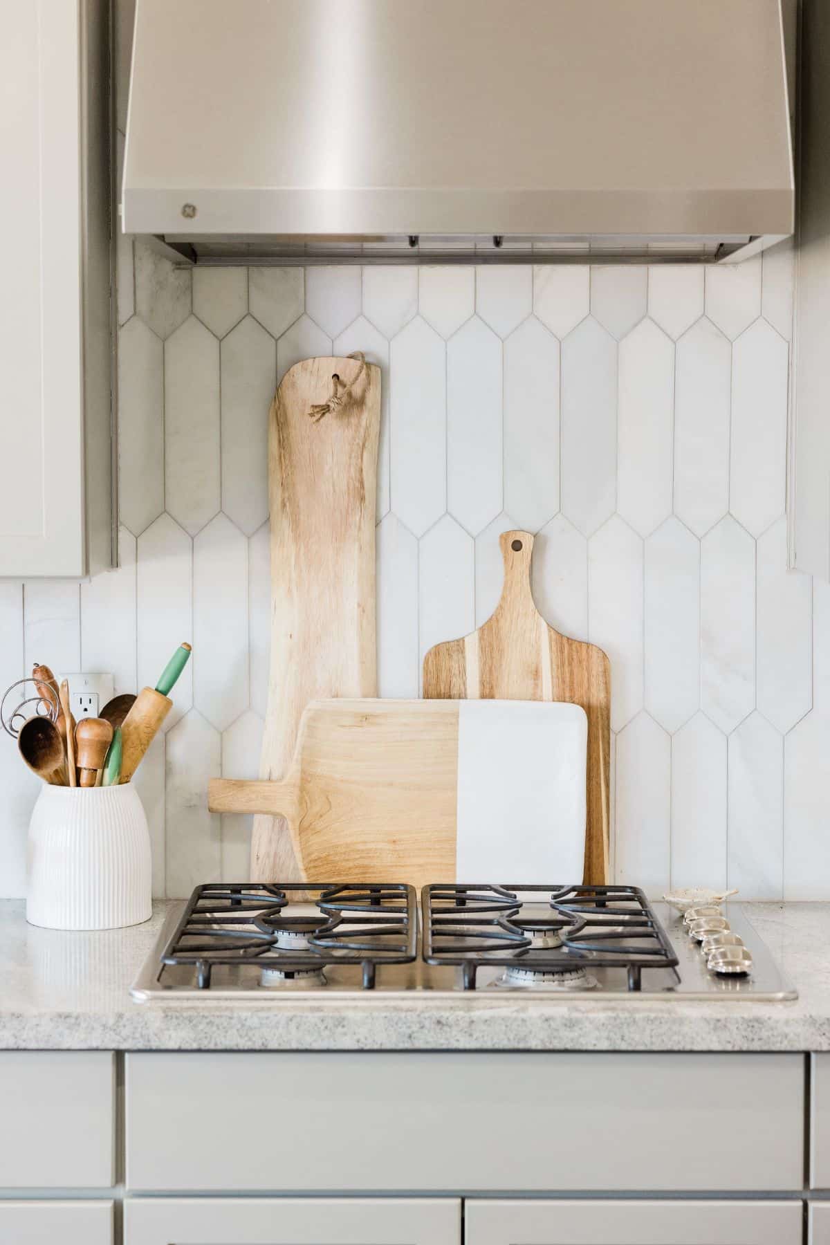 a stovetop in white kitchen.