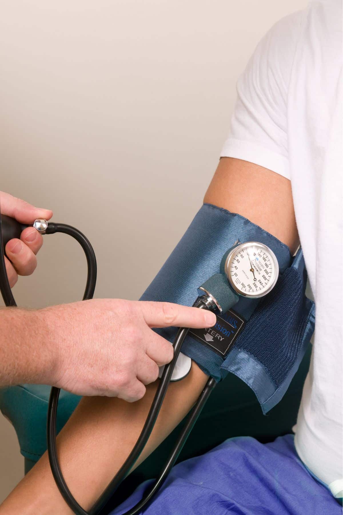 a doctor taking a person's blood pressure.