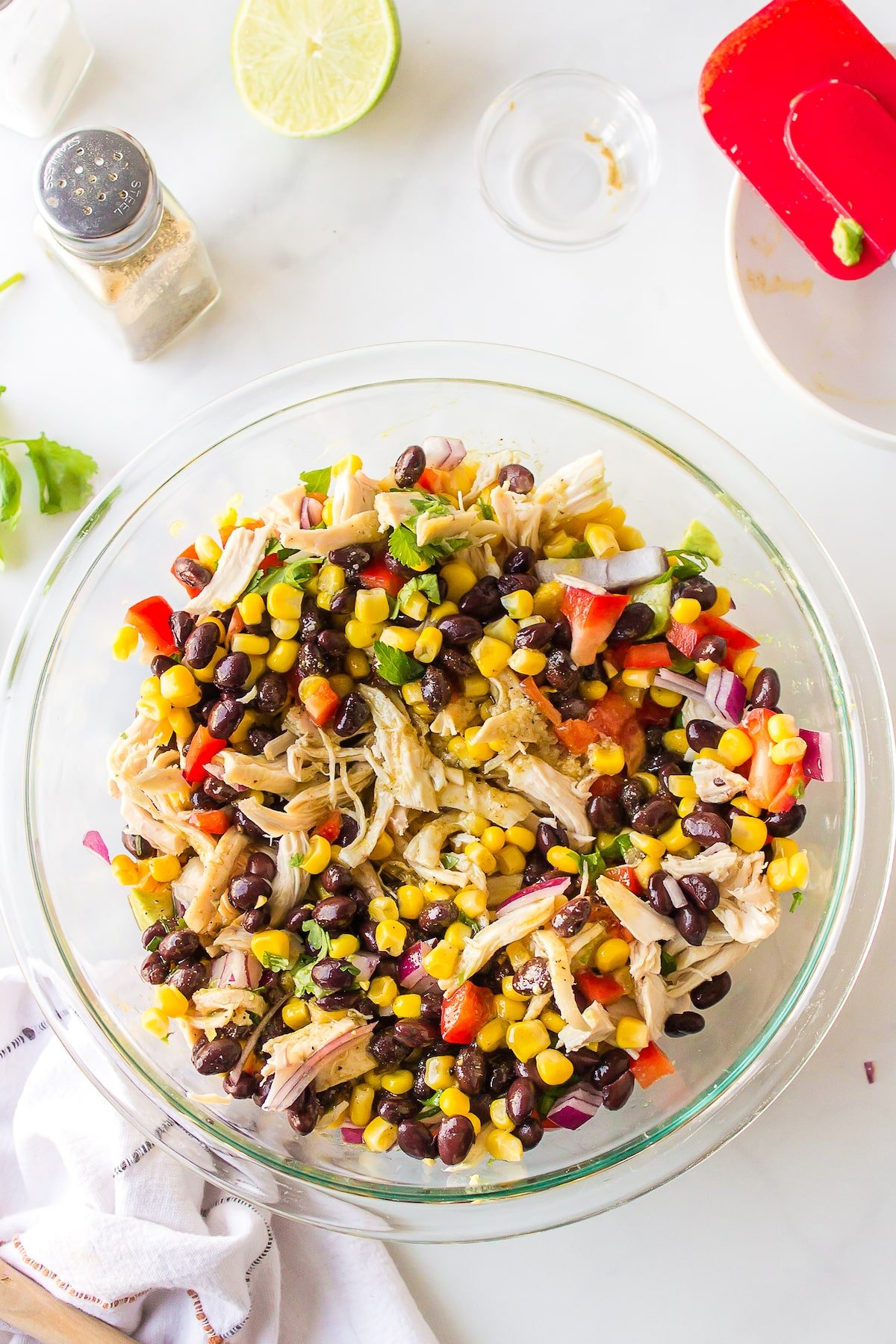 salad ingredients and dressing tossed together.