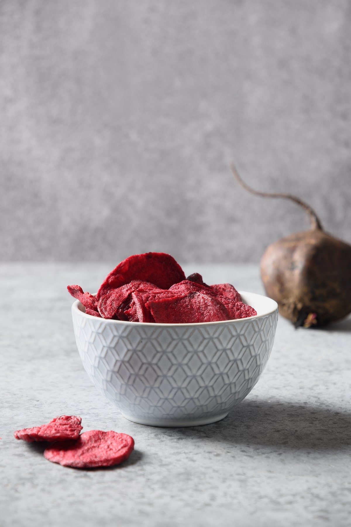 dehydrated beetroot chips in a bowl.