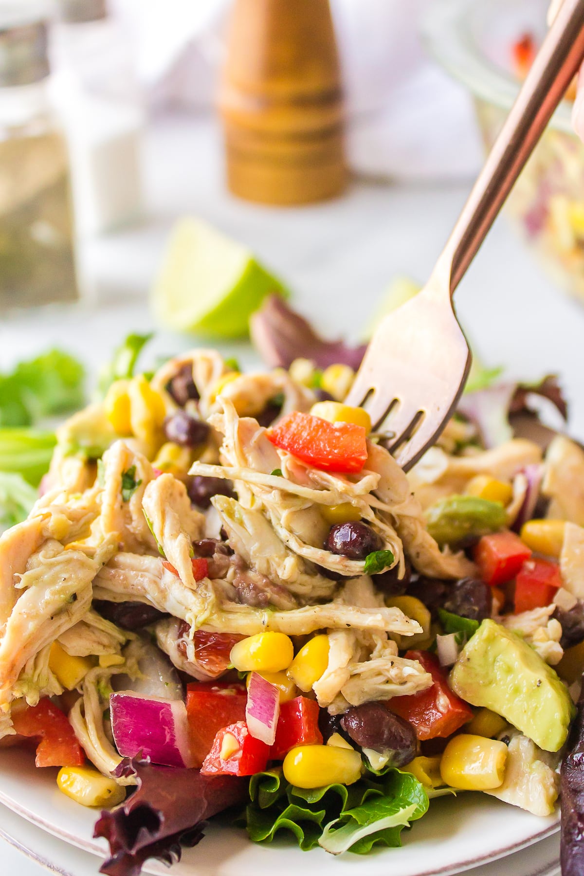 a fork holding a bit of Mexican Chicken Salad.