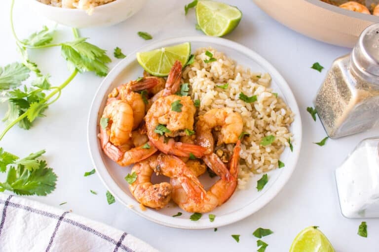 a plate of cilantro lime shrimp with rice.