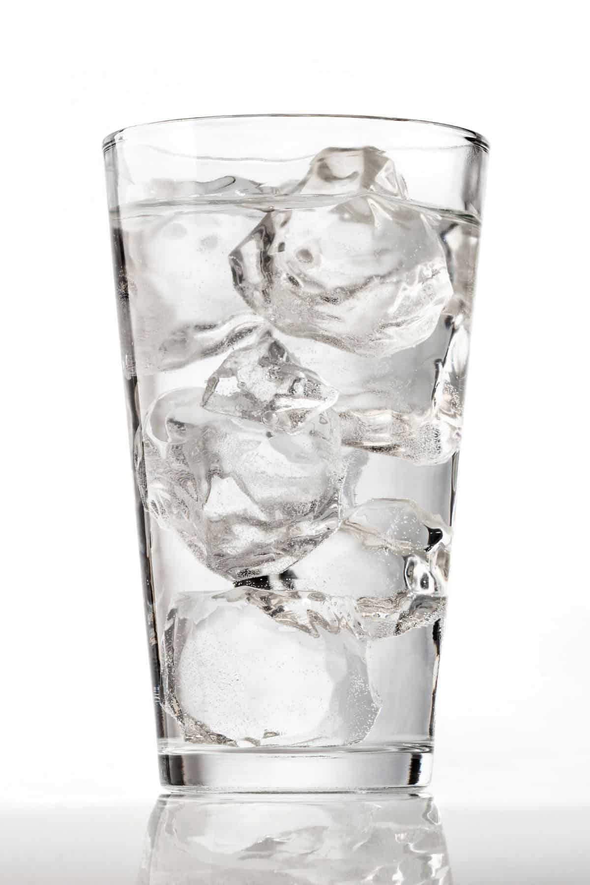 a glass of water with ice.