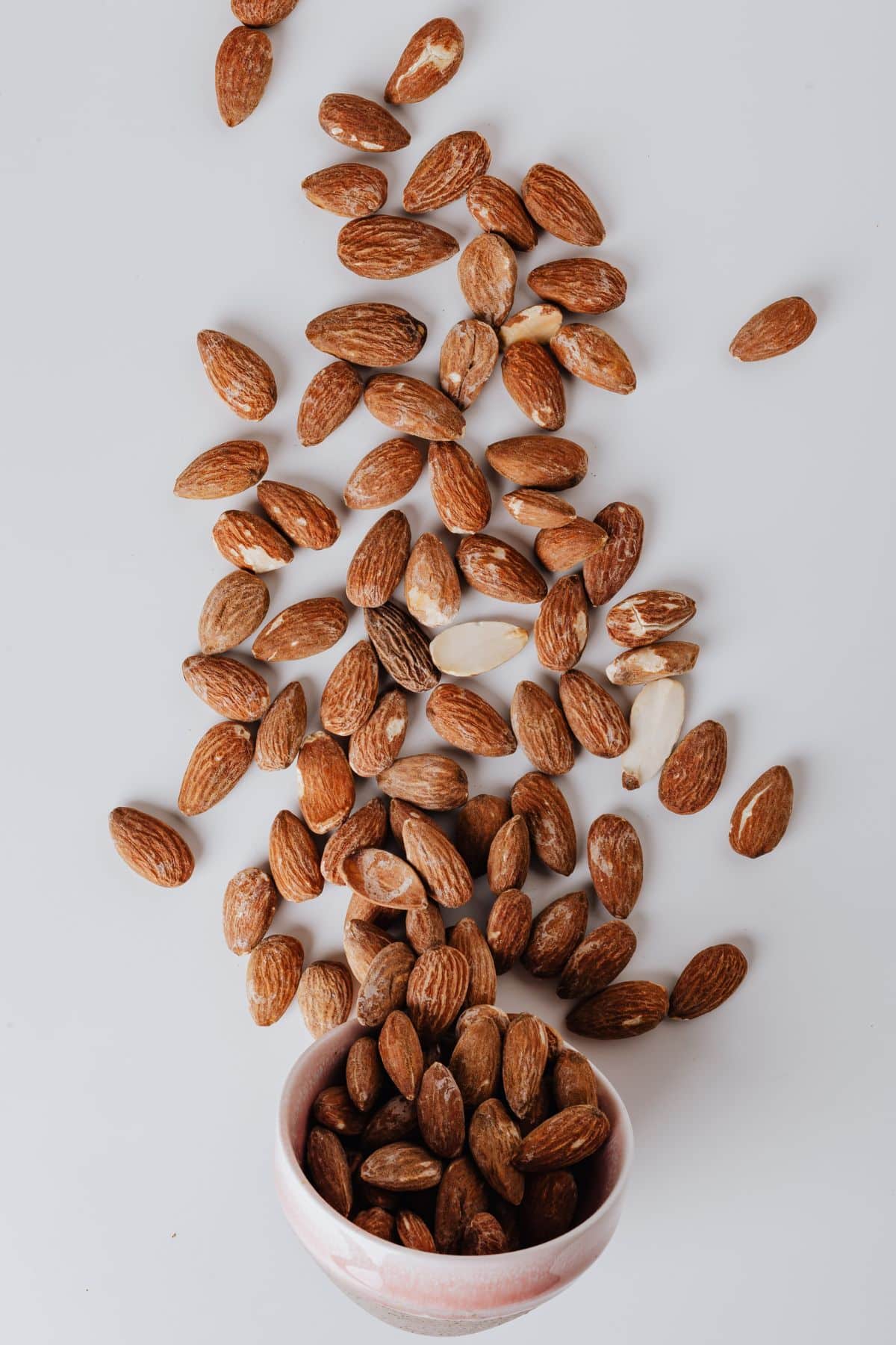 almonds spilling out of a bowl.