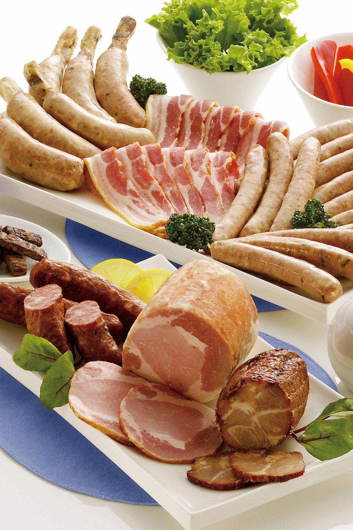 a variety of processed meats on a table.
