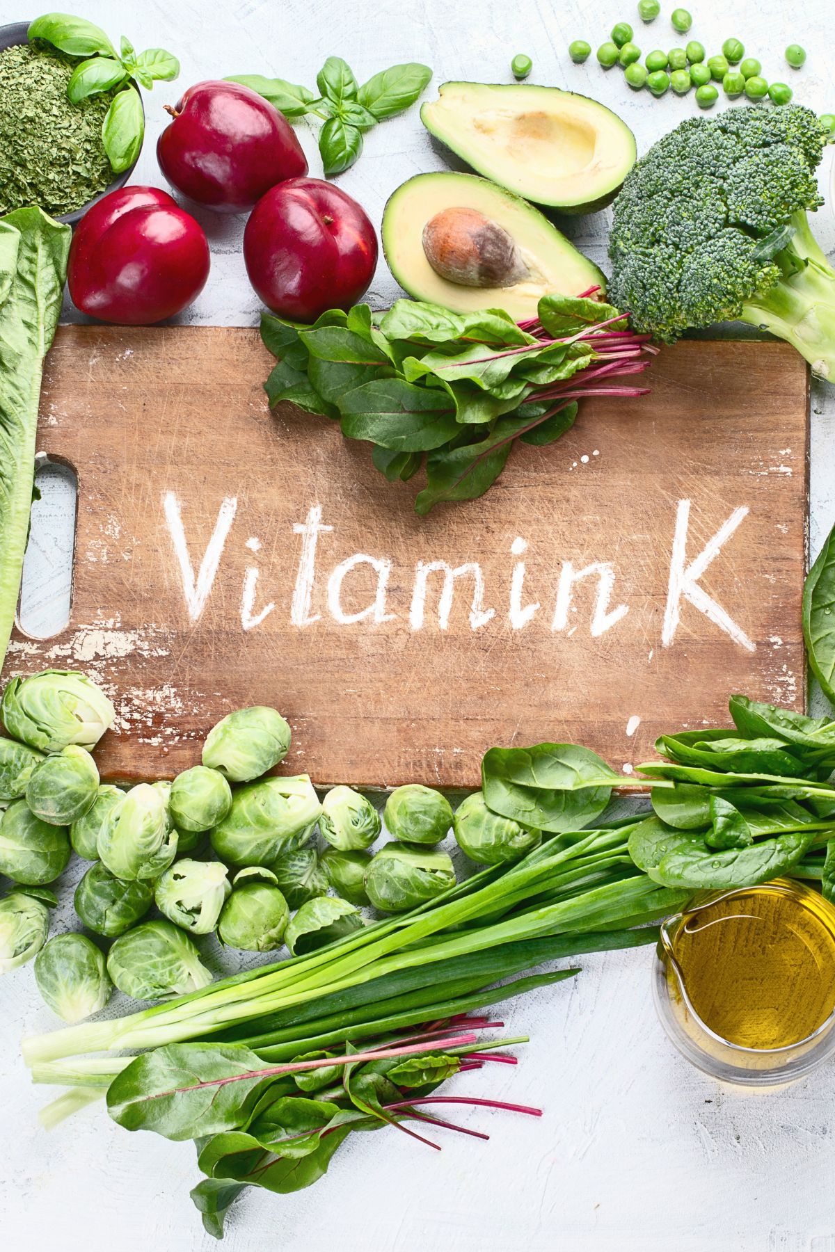 foods high in vitamin k surrounding a sign that says "vitamin k".