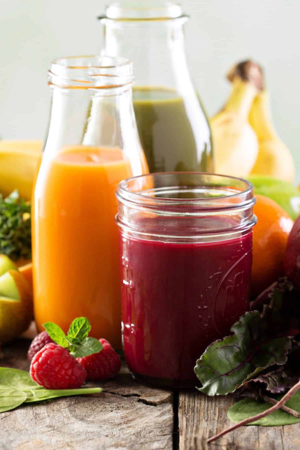 colorful anti-inflammatory juice recipes in three jars.