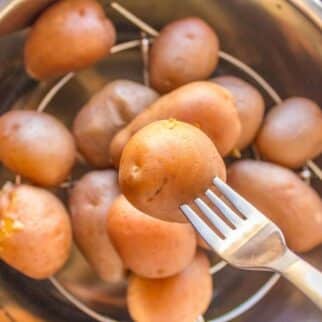 instant pot boiled potatoes with fork.