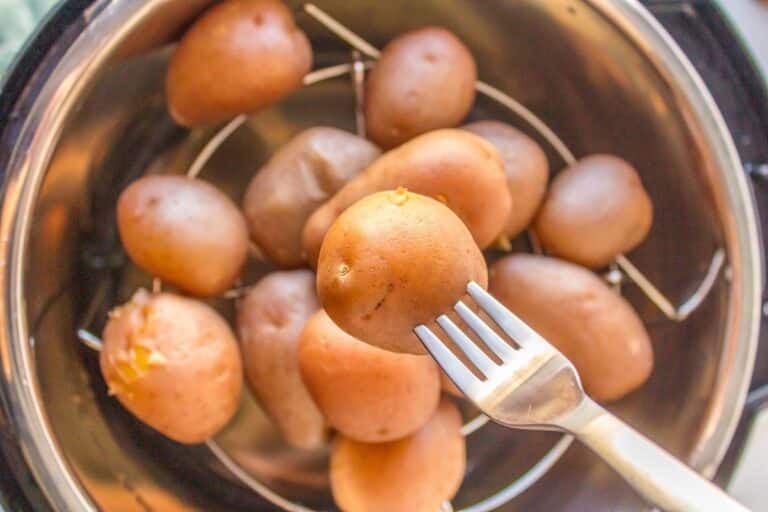 instant pot boiled potatoes with fork.