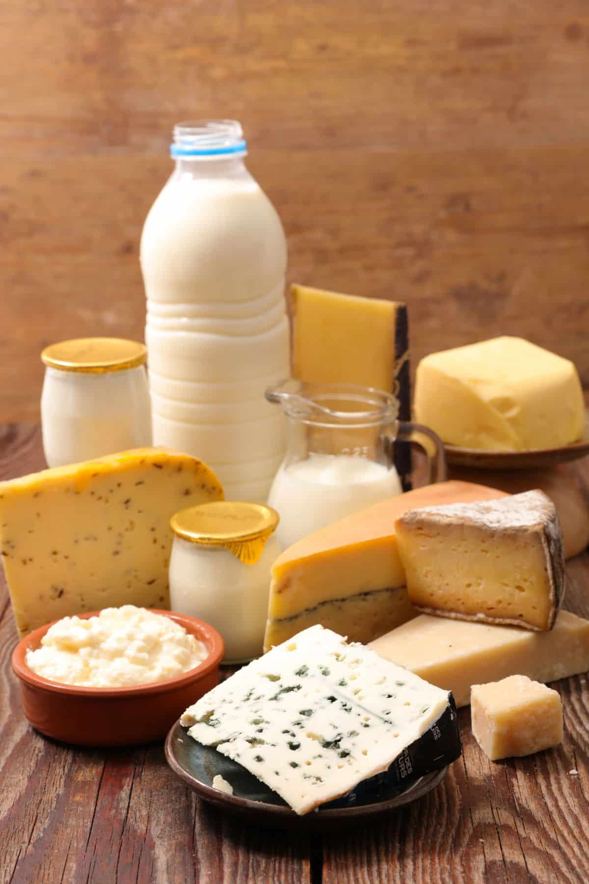 selection of milk and cheese on table.