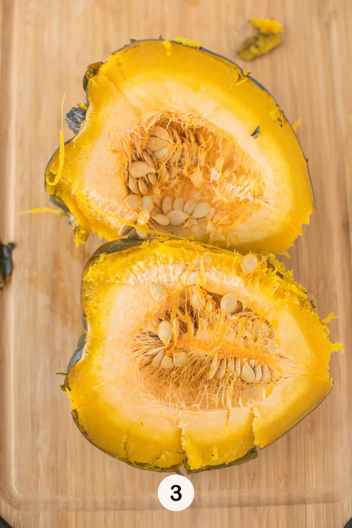cut acorn squash on cutting board.