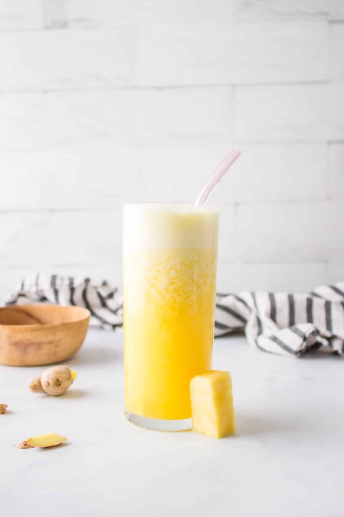 Pineapple Ginger Juice with straw.