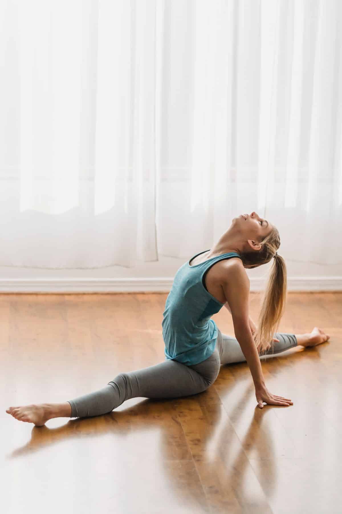 a woman doing a split.