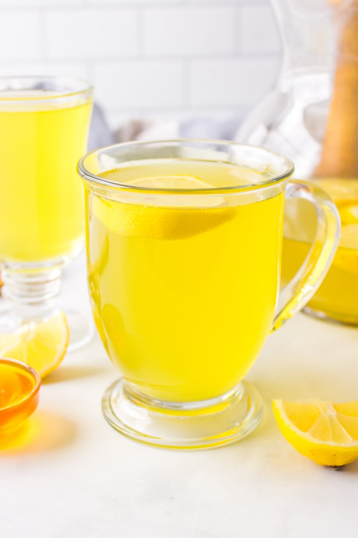 front view of lemon ginger turmeric tea in a mug. 