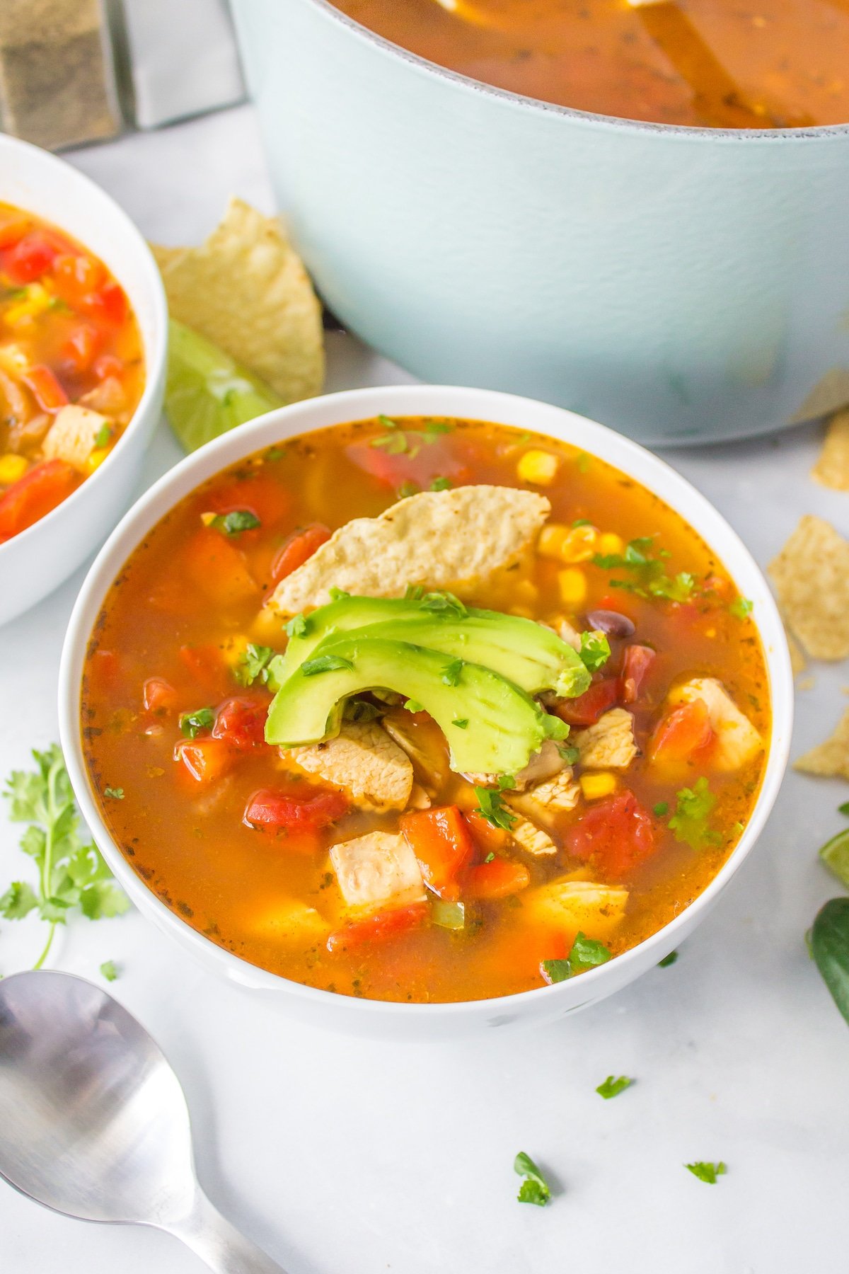 Panera chicken tortilla soup in a white bowl.