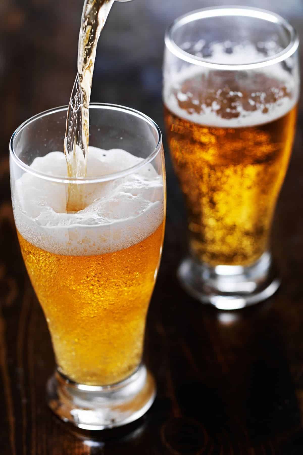 beer being poured into a glass.