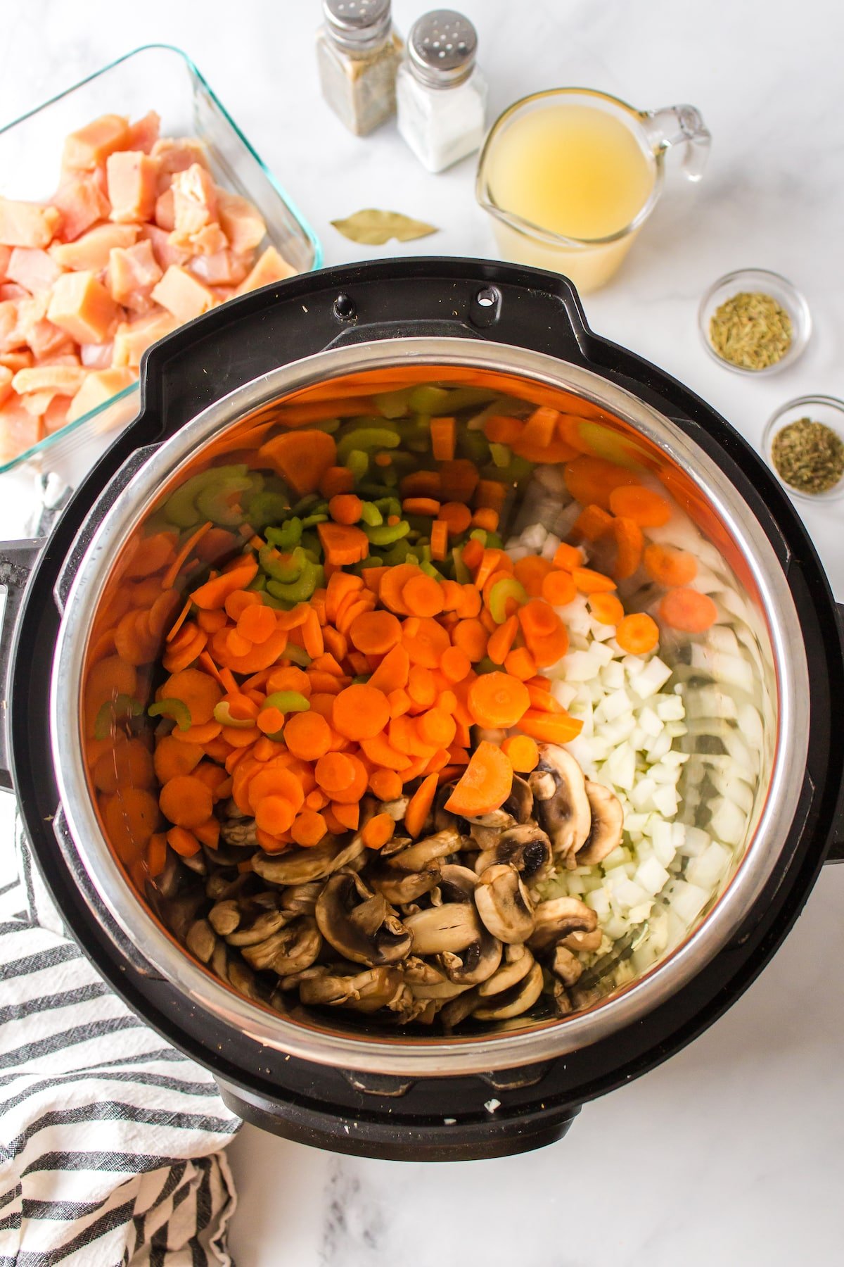 chicken potato soup ingredients in pot.