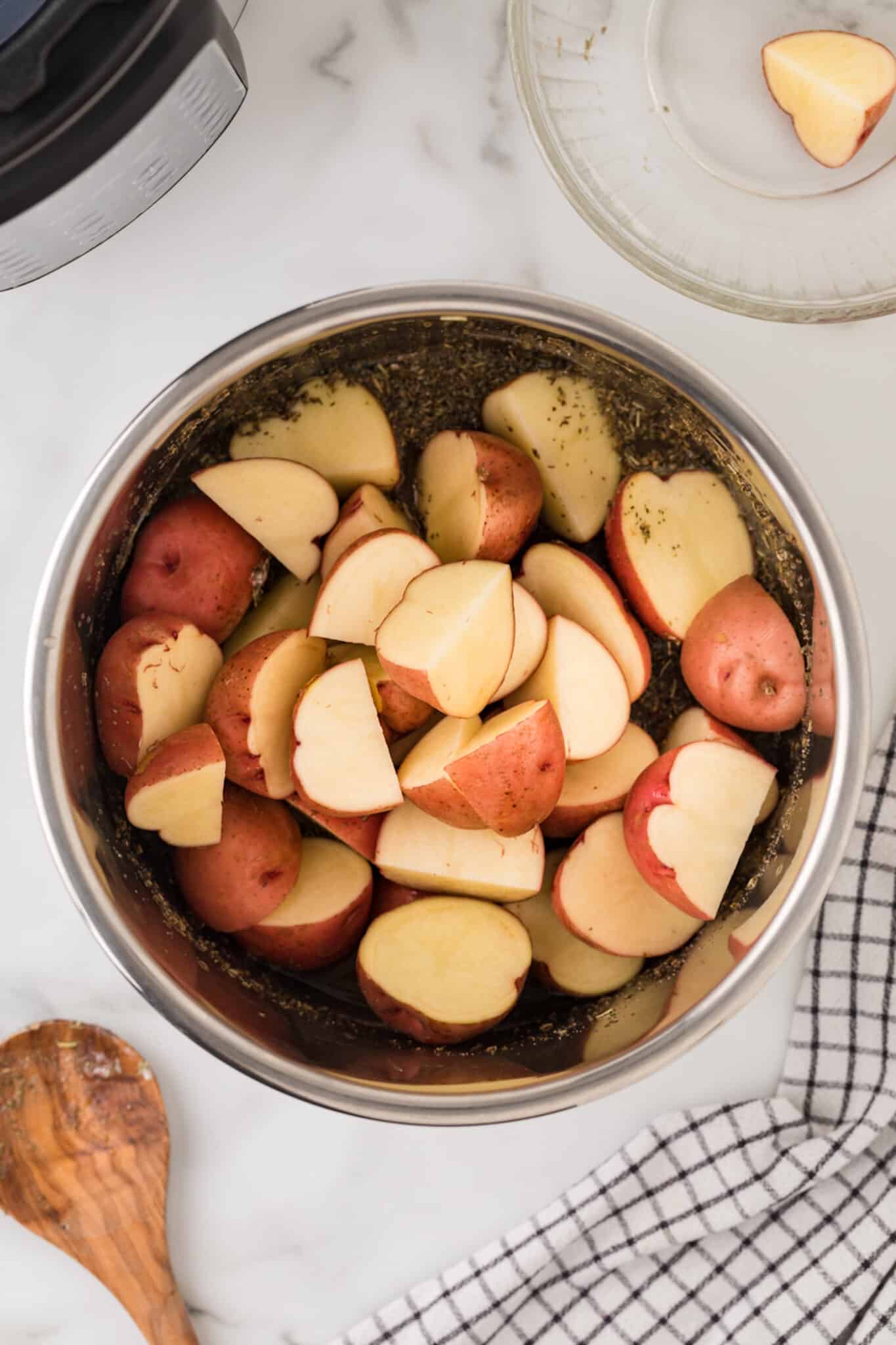 ingredients for instant pot red potatoes in pot with potatoes.