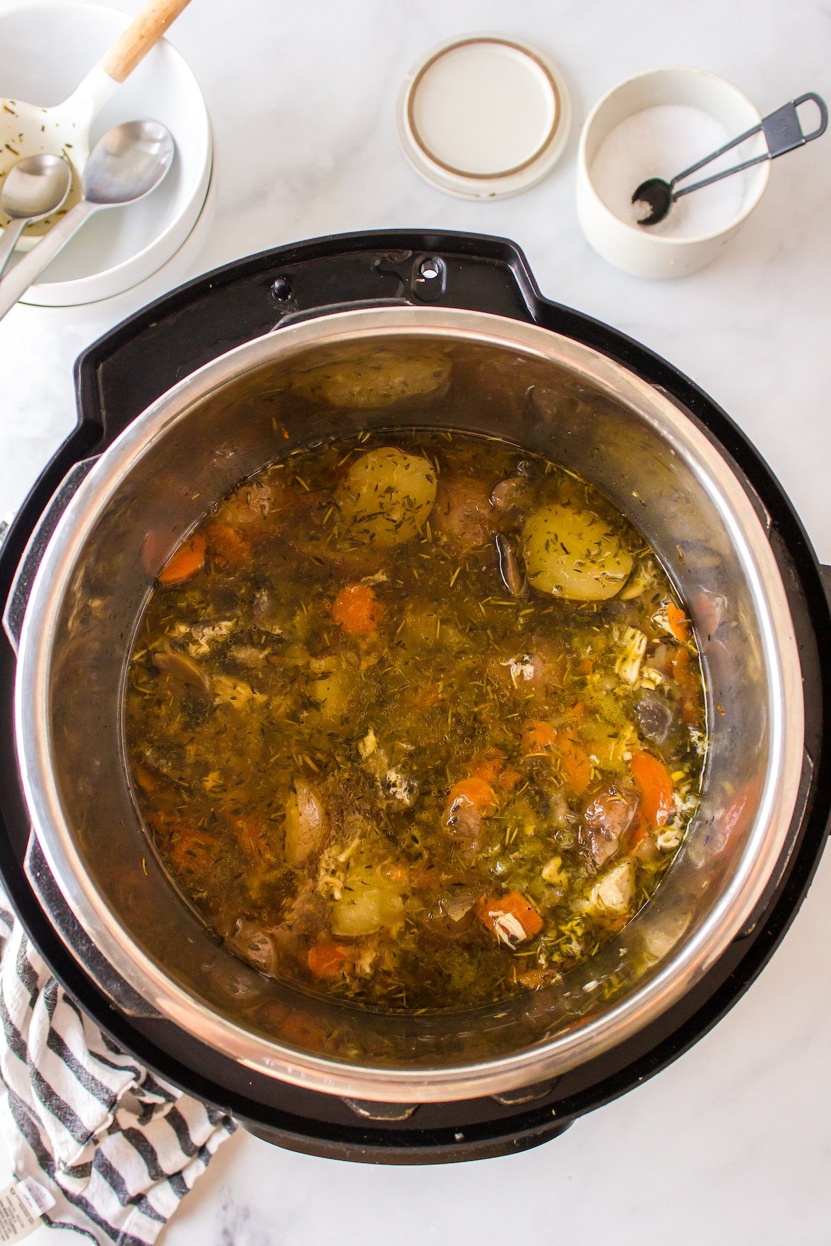 cooked chicken potato stew in pot.