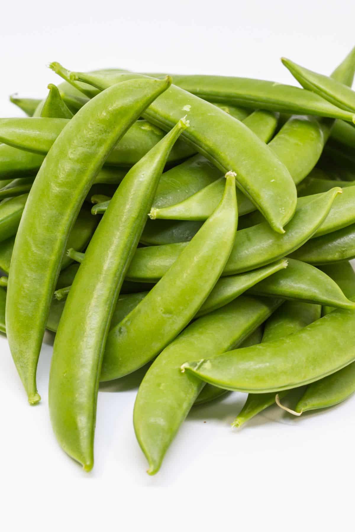 sugar snap peas on table.