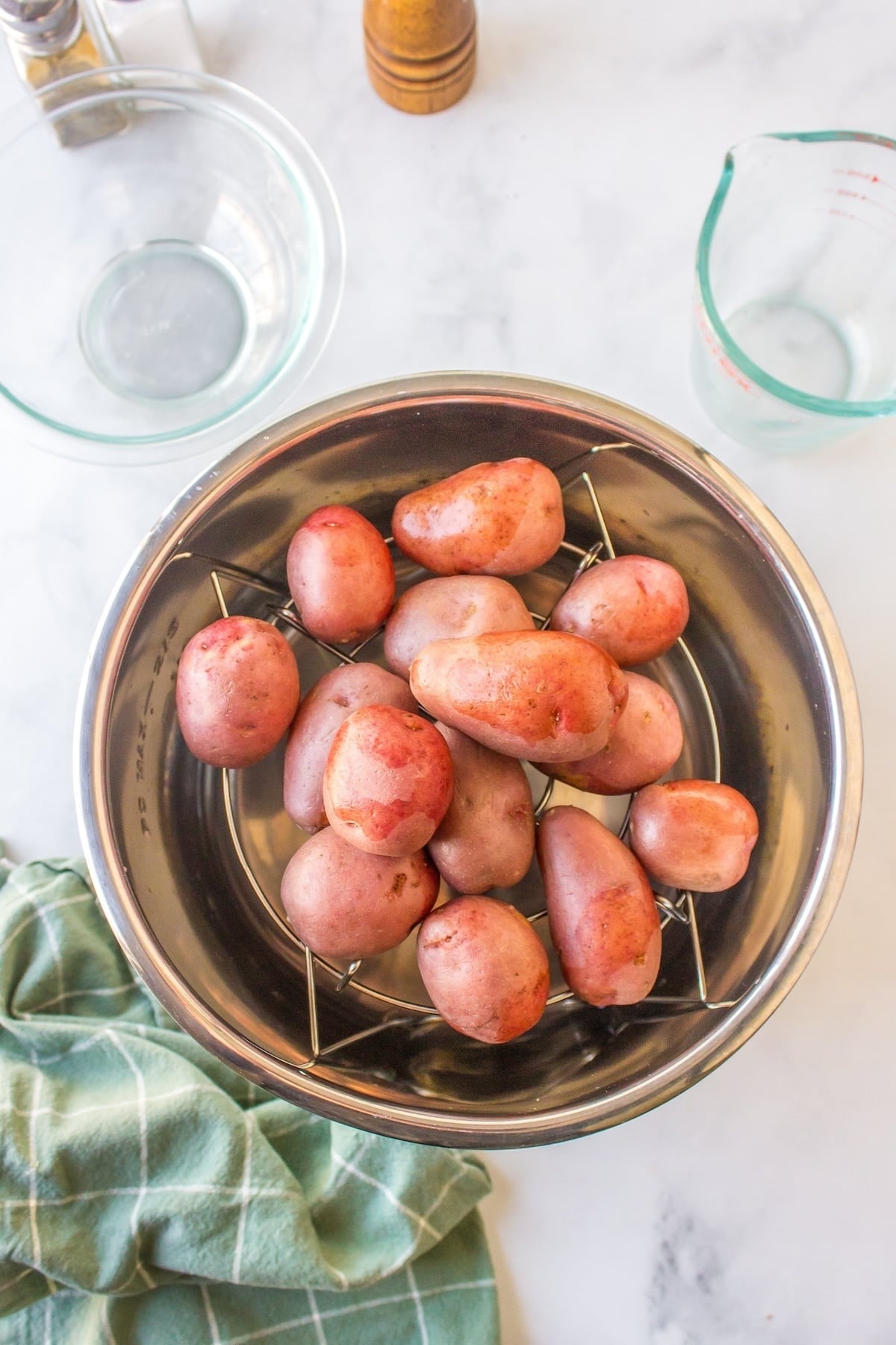 red potatoes ready to be boiled inside instant pot pressure cooker.